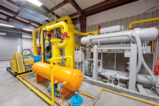 A compressor room is shown here, where the landfill gas is cleaned up and prepared before traveling to the engine.