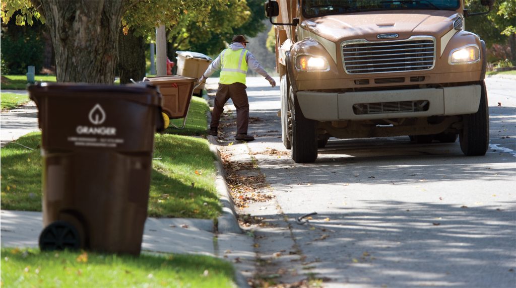 Granger Man Hauling Bins